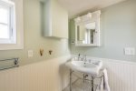 Bathroom on second floor from the hallway that is used for the two second floor guest rooms.